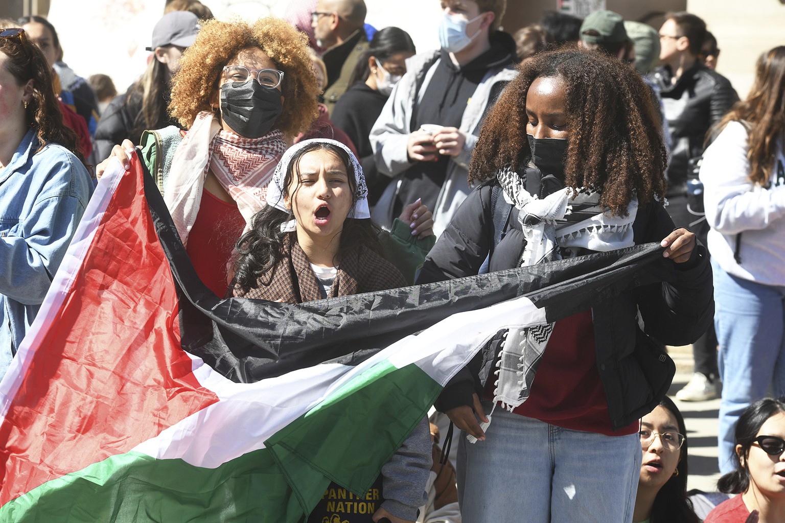 Several hundred students and pro-Palestinian supporters rally at the intersection of Grove and College Streets, in front of Woolsey Hall on the campus of Yale University in New Haven, Conn. April 22,  ...