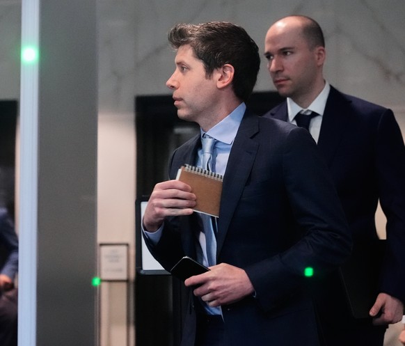 Sam Altman, center, and OpenAI president Greg Brockman, right, arrive at the U.S. District Court in Oakland, Calif., Thursday, April 30, 2026. (AP Photo/Godofredo A. Vásquez)
Sam Altman,Greg Brockman
