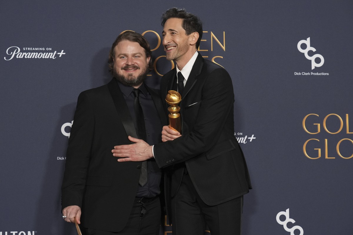 Brady Corbet, winner of the award for best director - motion picture for "The Brutalist", left, Adrien Brody, winner of the award for best performance by a male actor in a motion picture - d ...