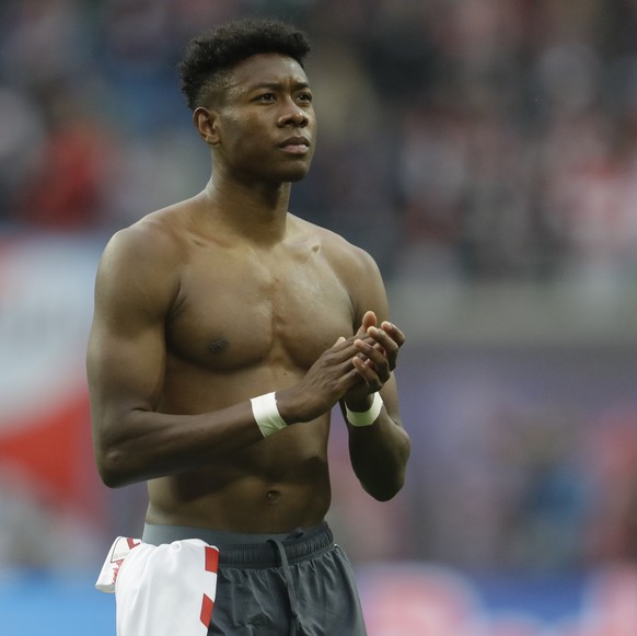 Bayern defender David Alaba greets supporters at the end of the German Bundesliga soccer match between Leipzig and Bayern Munich at the Red Bull Arena stadium in Leipzig, Germany, Saturday, May 11, 20 ...