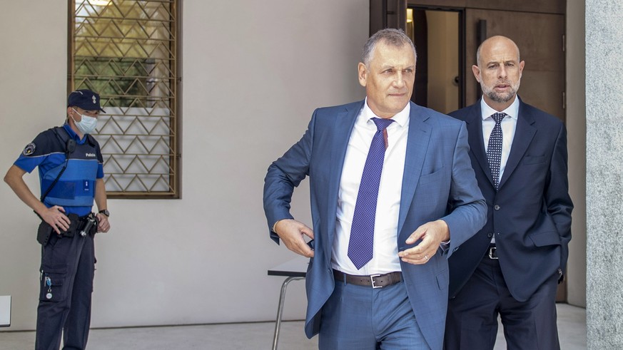 epa08668236 Former Fifa general secretary Jerome Valcke, center, and his lawyer Patrick Hunziker arrive at the Federal Criminal Court in Bellinzona, Switzerland, 14 September 2020. PSG president Al-Kh ...