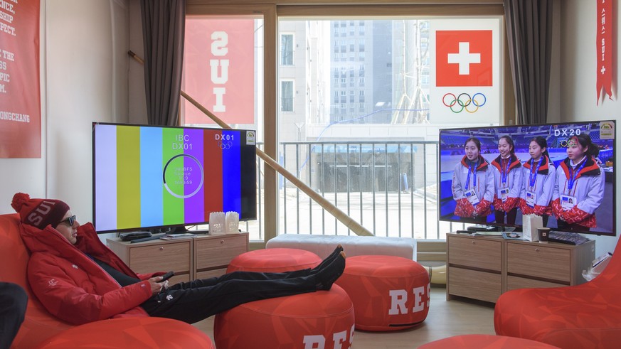 Swiss ski jumping athlete Simon Ammann watches tv during a media tour through the Pyeongchang Olympic Village one day prior to the opening of the XXIII Winter Olympics 2018 in Pyeongchang, South Korea ...