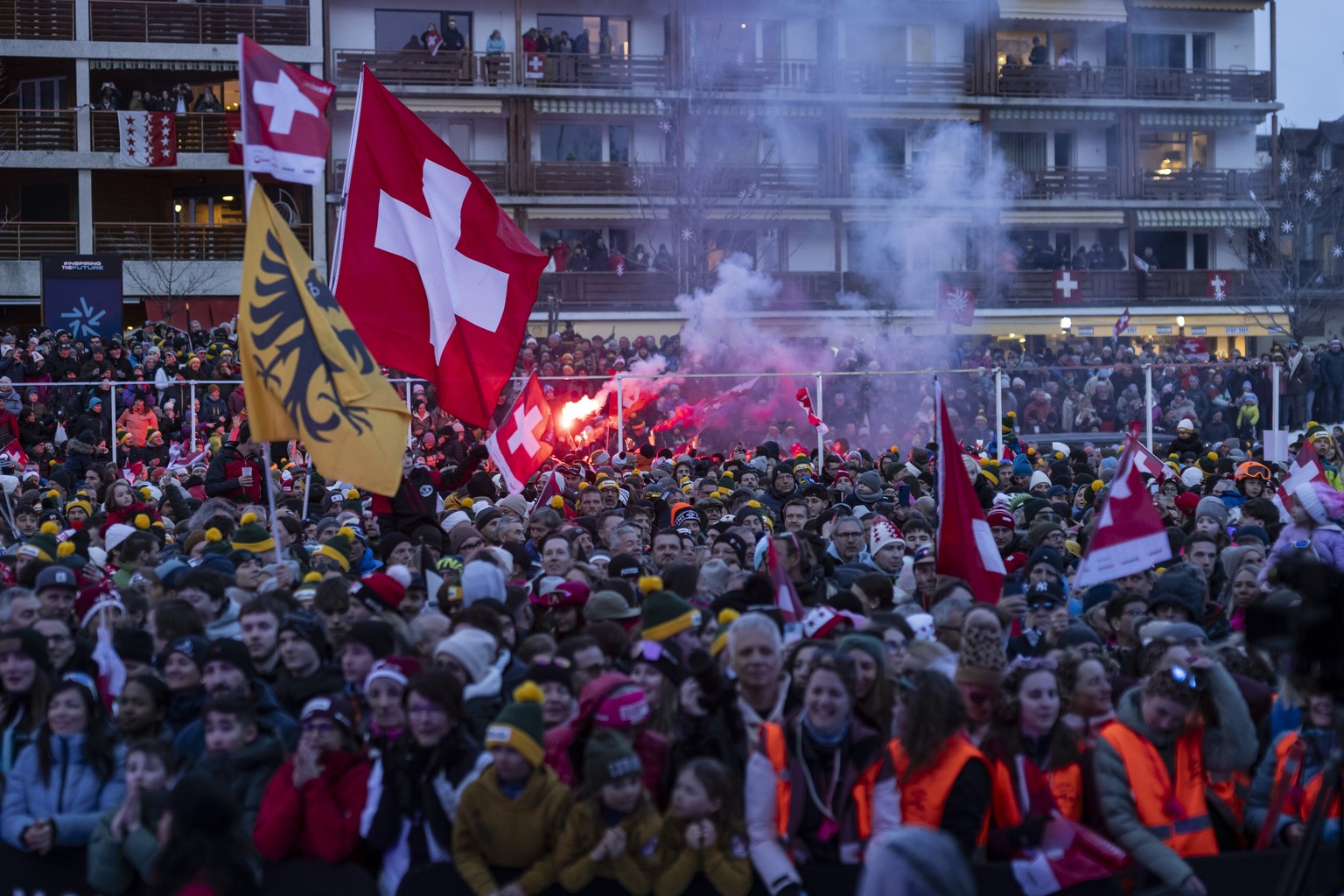 Thousands of fans celebrate ahead of the price giving ceremony of the men&#039;s Downhill race at the Alpine Skiing FIS Ski World Cup, in Crans-Montana, Switzerland, Saturday, February 22, 2025. (KEYS ...