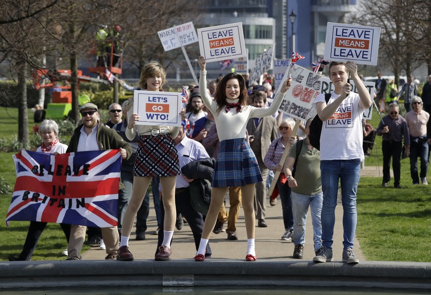 Pro-Brexit leave the European Union supporters pose for photos as they take part in the final leg of the &quot;March to Leave&quot; in London, Friday, March 29, 2019. The protest march which started o ...