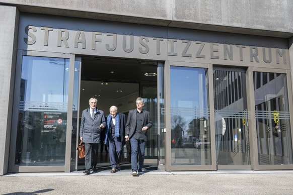 Former Fifa President, Joseph (Sepp) Blatter, centre, his Loyer Lorenz Erni, left, and his Media Speaker, right, are on the way to Lunchtime in front of the special appeals court, in Muttenz, Switzerl ...