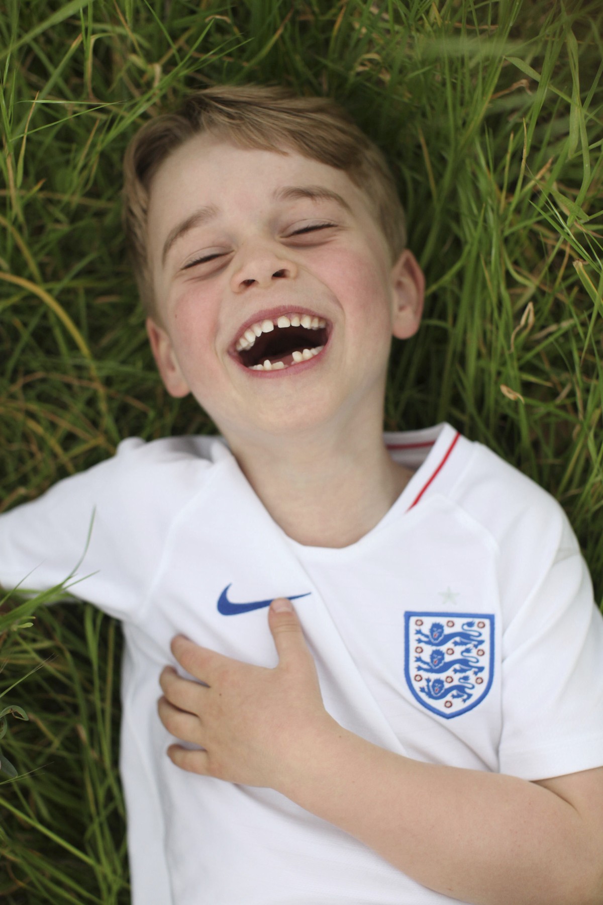 In this undated photo released by the Duke and Duchess of Cambridge on Sunday, July 21, 2019, Britain's Prince George poses for a photo taken by his mother, Kate, the Duchess of Cambridge, in the ...