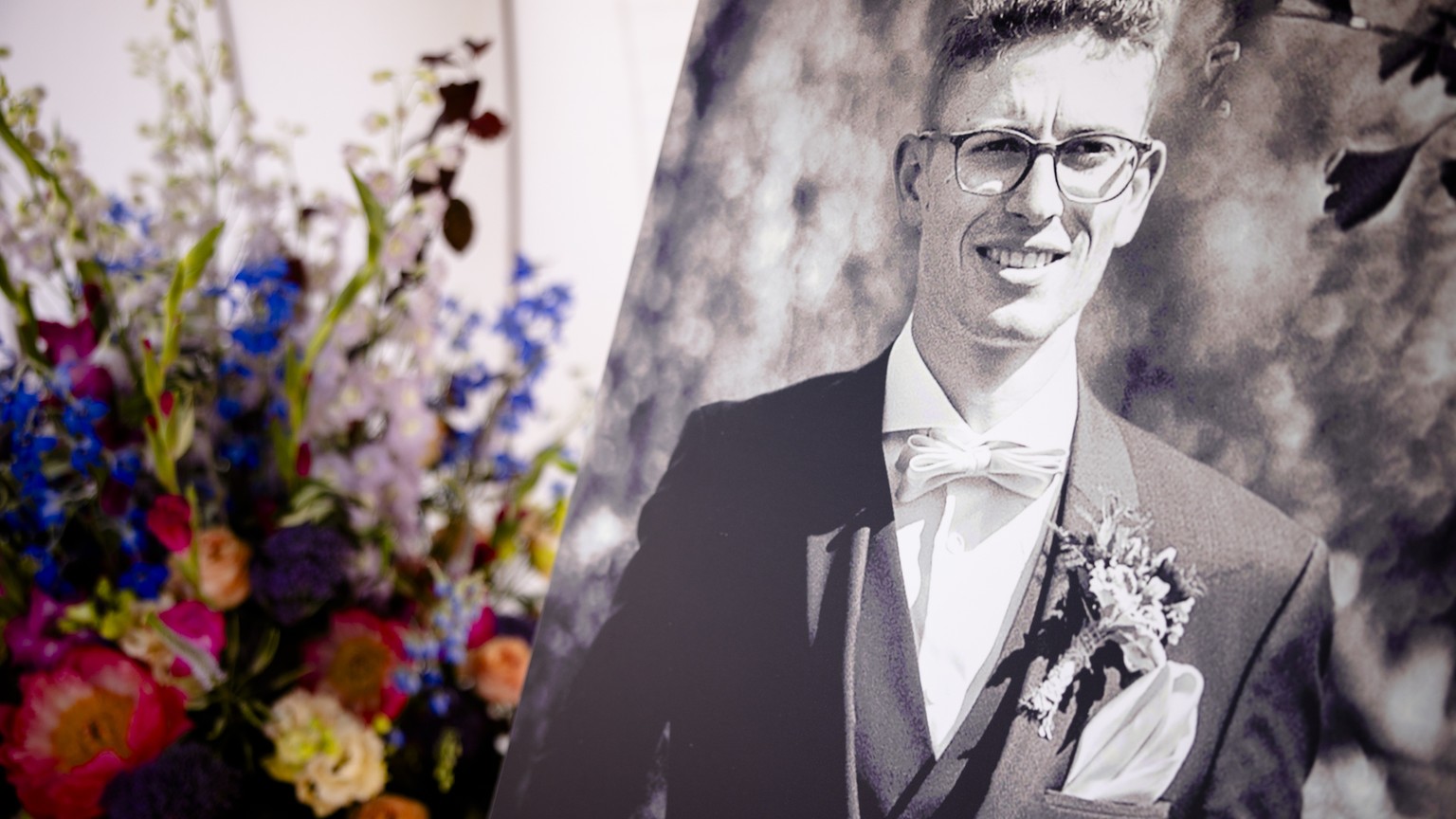 A photograph of deceased racer Gino Maeder of Switzerland is seen beside flowers on the open racetrack &quot;Offene Rennbahn&quot; in Zurich Oerlikon, Switzerland, on Saturday, June 24, 2023. Gino Mae ...