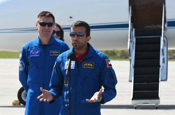 CAPE CANAVERAL, FLORIDA, UNITED STATES - FEBRUARY 21: Sultan Al Neyadi of the United Arab Emirates speaks to the media as Russian cosmonaut Andrey Fedyaev (L) looks on after arriving at the Kennedy Sp ...