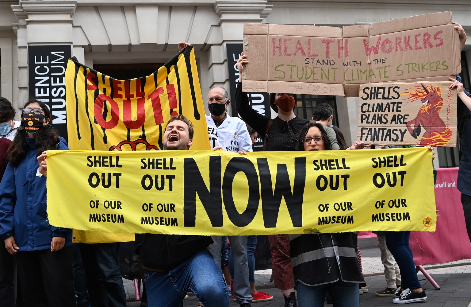 epa09288348 Climate change protesters demonstrate outside the Science Museum in London, Britain, 20 June 2021. Young student climate change activists, who were threatened with arrest by police 19 June ...