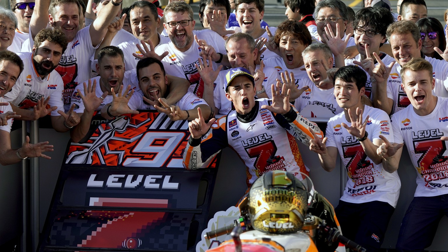 Spain&#039;s rider Marc Marquez celebrates with team crews after the MotoGP Japanese Motorcycle Grand Prix at the Twin Ring Motegi circuit in Motegi, north of Tokyo, Sunday, Oct. 21, 2018. (AP Photo/S ...