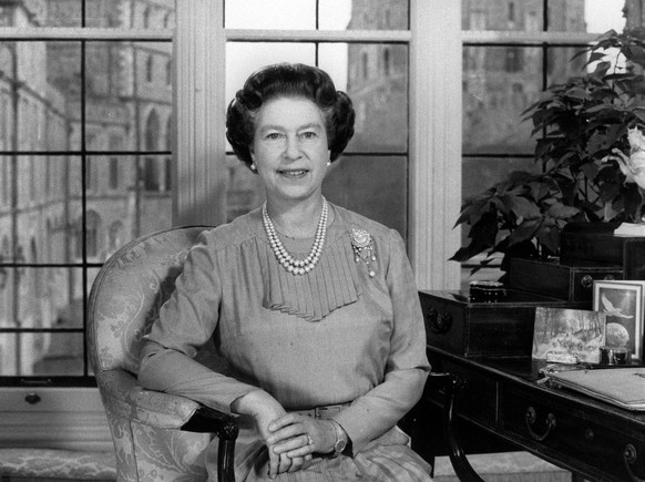 1984 Queen Elizabeth II, when she delivered her Christmas Day message on television. She spoke from the Oak Room of Windsor Castle, dressed in green jade and sitting by a desk with part of the castle ...