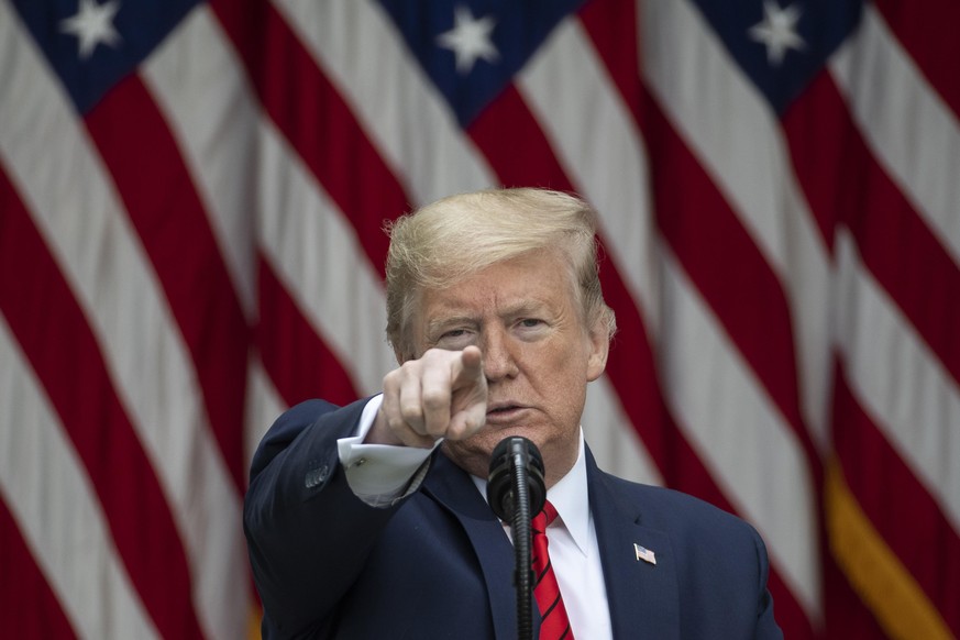 In this May 11, 2020 photo, President Donald Trump points to a question as he speaks about the coronavirus during a press briefing in the Rose Garden of the White House in Washington. Trump has many t ...