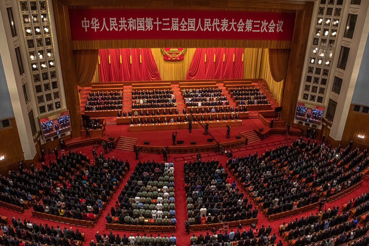 epa08449407 Delegates attend the closing ceremony of the third session of the 13th National People's Congress (NPC) at the Great Hall of the People in Beijing, China, 28 May 2020. The NPC runs pa ...