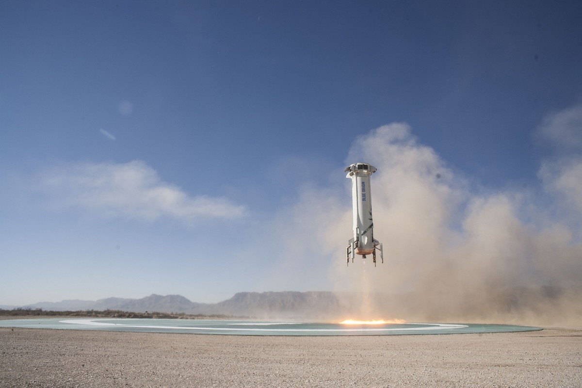 In this photo provided by Blue Origin, the New Shepard booster lands in west Texas during a test on Tuesday, Dec. 12, 2017. Named after the first American in space, Alan Shepard, the spacecraft made a ...