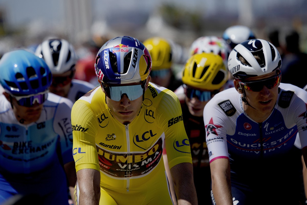 Belgium's Wout Van Aert, wearing the overall leader's yellow jersey rides in the pack during the fourth stage of the Tour de France cycling race over 171.5 kilometers (106.6 miles) with star ...