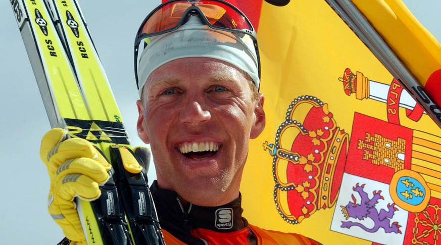 Spain&#039;s Johann Muehlegg celebrates with the flag after winning the gold medal in the men&#039;s cross-country pursuit at the Winter Olympics Thursday, Feb. 14, 2002, at Soldier Hollow in Midway,  ...