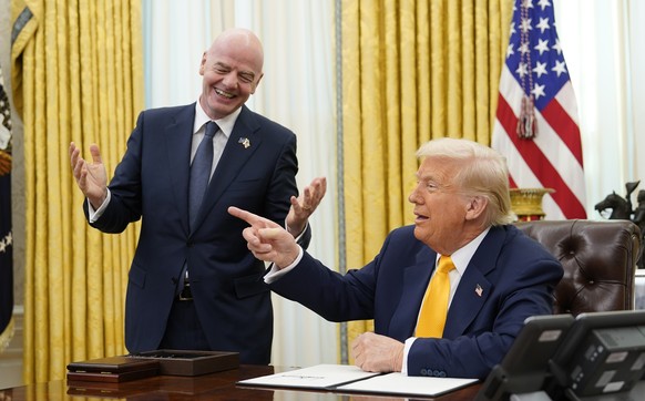 epa11947882 FIFA President Gianni Infantino (L) makes remarks as he meets United States President Donald J Trump who will sign an Executive Order setting up a task force on the World Cup in the Oval O ...