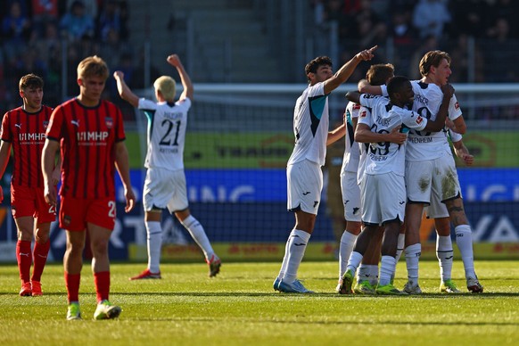 epa12801581 Hoffenheim players celebrate the 0-2 goal during the German Bundesliga soccer match between 1. FC Heidenheim against TSG Hoffenheim in Heidenheim, Germany, 07 March 2026. EPA/ANNA SZILAGYI