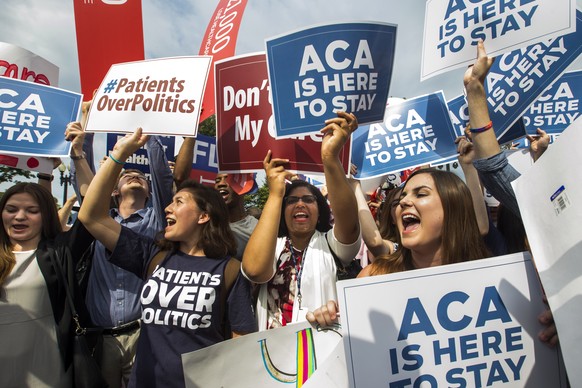 epa07232853 (FILE) - Supporters of the Affordable Care Act cheer after the Supreme Court ruled that Obamacare tax credits can go to residents of any state, outside the Supreme Court in Washington, DC, ...