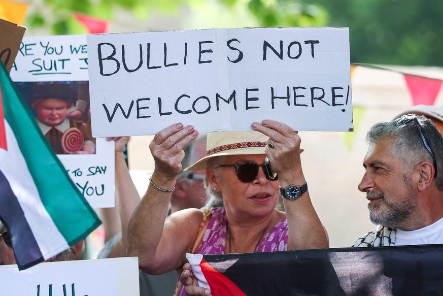 People attend the &quot;Vance not welcome party&quot; protest, organised by Everybody Hates Elon and Stop Trump Coalition, as U.S. Vice President JD Vance spends his holiday nearby, in Charlbury, Cots ...