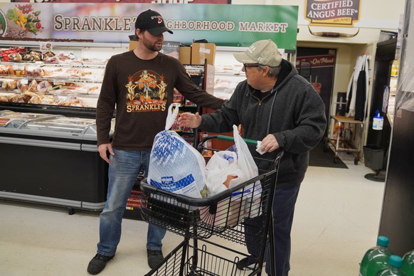 Ryan Sprankle, left, owner of Sprankle&#039;s Neighborhood Market, speaks with Timothy A. Mohney at the market Monday, Nov. 10, 2025, in Kittanning, Pa. (AP Photo/Jessie Wardarski)
Government Shutdown ...