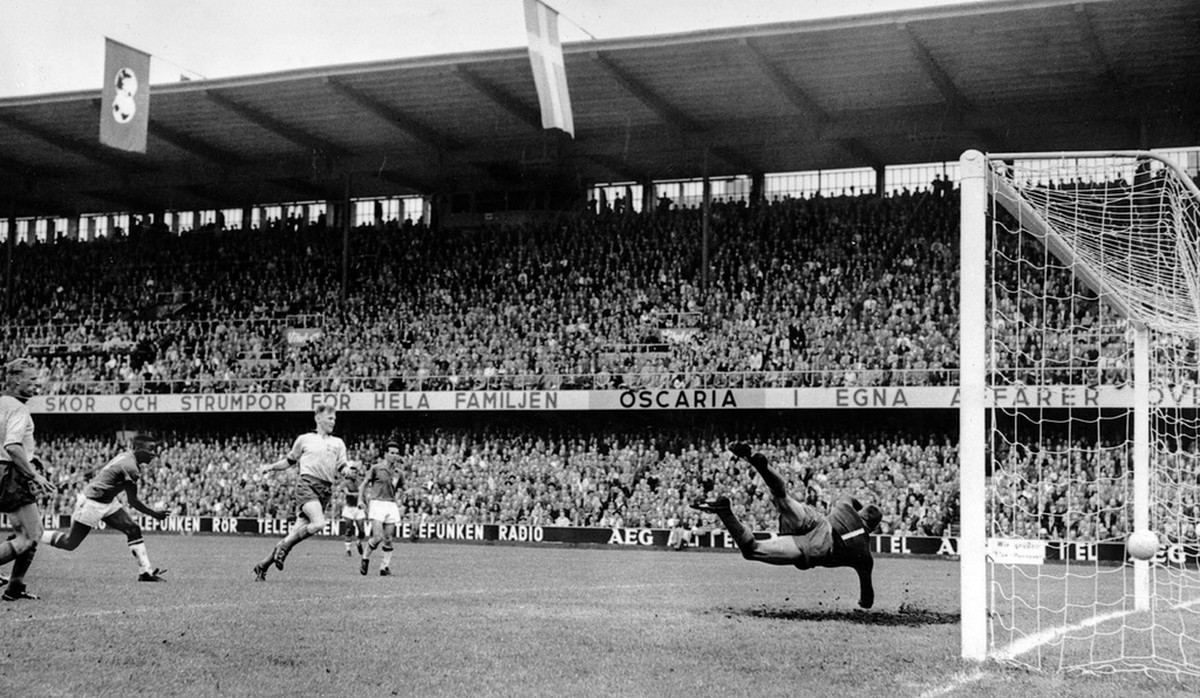 Seventeen-year-old Pele, second from left, scores Brazil's third goal in the World Cup soccer final against Sweden in Stockholm, June 29, 1958. At right, Sweden's goalkeeper Kalle Svensson m ...