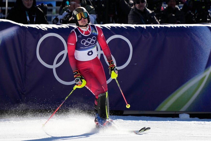 Austria's Katharina Huber at the finish area of an alpine ski, women's slalom race, at the 2026 Winter Olympics, in Cortina d'Ampezzo, Italy, Wednesday, Feb. 18, 2026. (AP Photo/Andy Wo ...