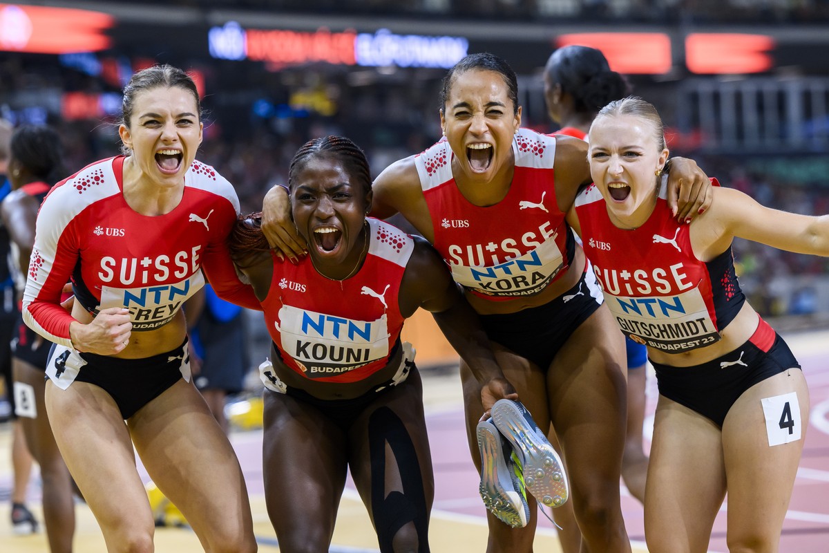 Geraldine Frey, Natacha Kouni, Salome Kora and Melissa Gutschmidt of Switzerland react during the women's 4x100 meters relay qualification of the World Athletics Championships at the National Ath ...