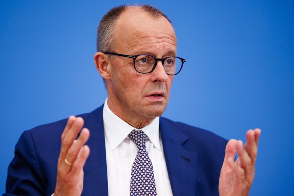 epa12245048 German Chancellor Friedrich Merz gestures during the annual summer news conference at the Federal Press Conference (Bundespressekonferenz) in Berlin, Germany, 18 July 2025. The traditional ...