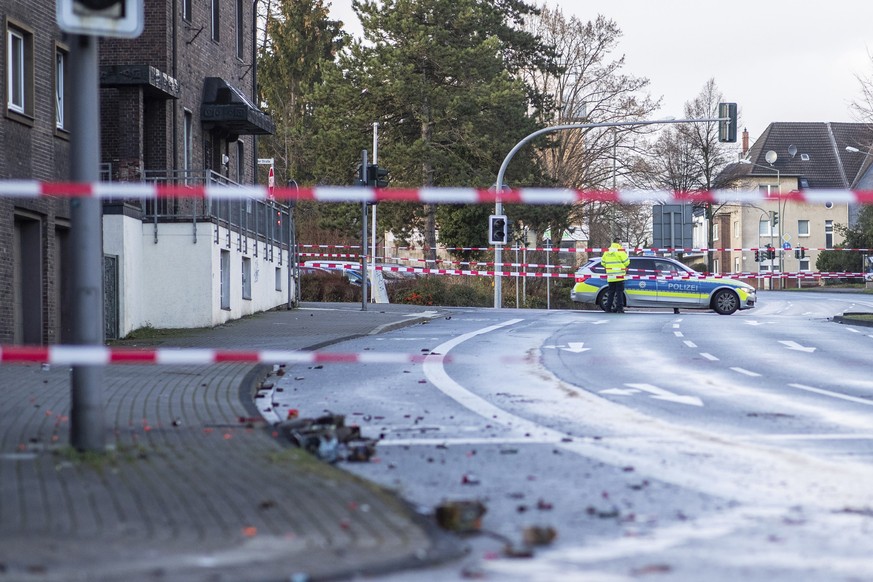 The Police blocks a road in Bottrop, Germany, Tuesday, Jan. 1, 2019. A man has been arrested in Germany after ploughing his car into a crowd of people, injuring at least four, in what appears to have  ...