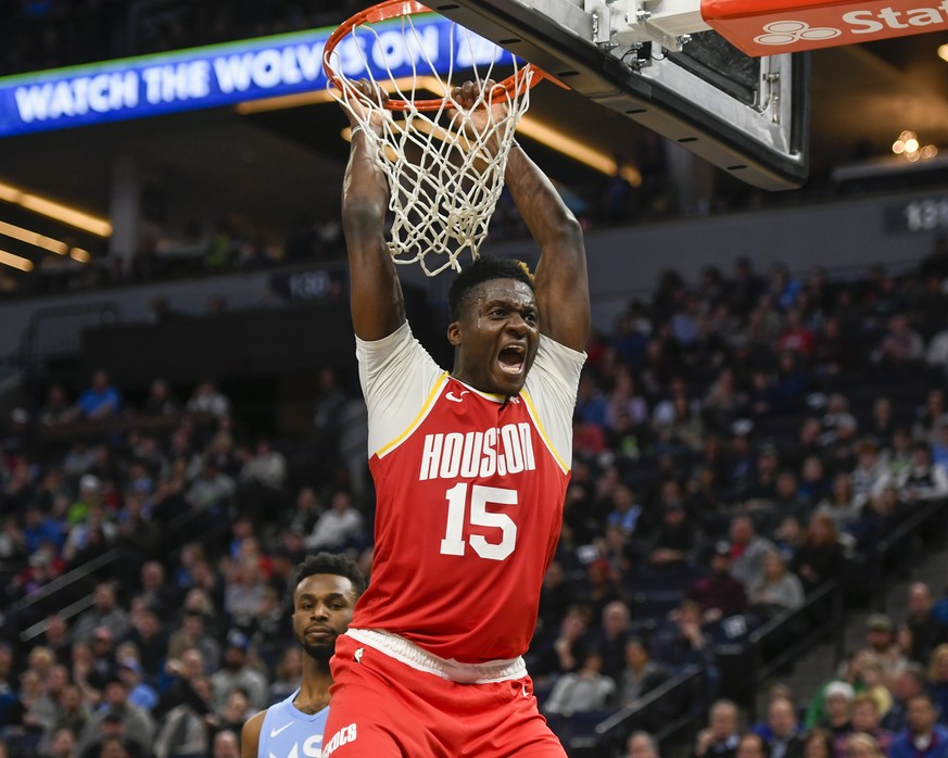 Houston Rockets center Clint Capela yells after dunking the ball against the Minnesota Timberwolves during the second half of an NBA basketball game Friday, Jan. 24, 2020, in Minneapolis. (AP Photo/Cr ...