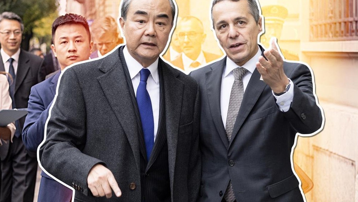 Swiss Foreign minister, Federal Councillor Ignazio Cassis, right, walks to a joint press conference with his guest Wang Yi, Foreign Minister of the PeopleÕs Republic of China, staying on an official w ...