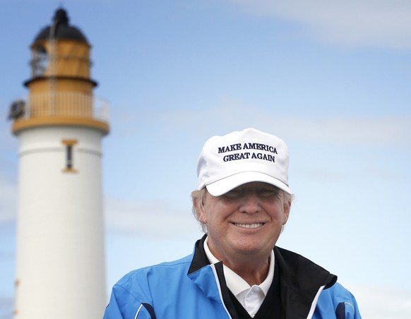 FILE - In this Saturday, Aug. 1, 2015, file photo, Republican presidential candidate Donald Trump poses for the media during the third day of the Women&#039;s British Open golf championship on Trump&# ...