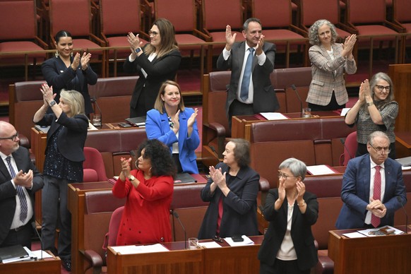 Labor senators applaud after passing the vote to Parliament in the Senate Chamber of the Parliament House of Australia, in Canberra, Monday, June 19, 2023. The Senate voted to hold a referendum…