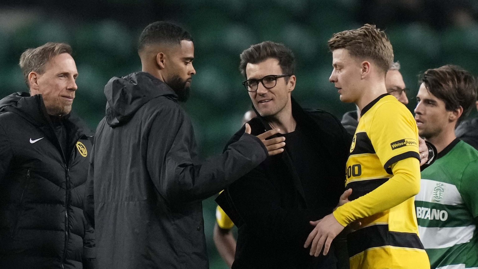 Young Boys&#039; head coach Raphael Wicky, center, and his team shake hands after the Europa League playoff second leg soccer match between Sporting CP and Young Boys at the Alvalade stadium in Lisbon ...