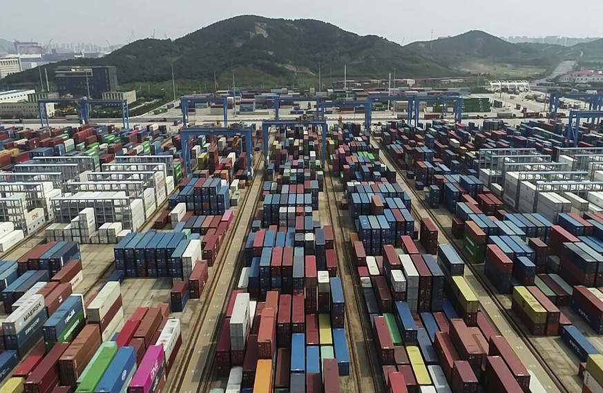 Containers are placed at a port in Qingdao in eastern China&#039;s Shandong province on Tuesday, Sept. 1, 2020. China&#039;s export growth accelerated in August while imports edged lower as the world& ...
