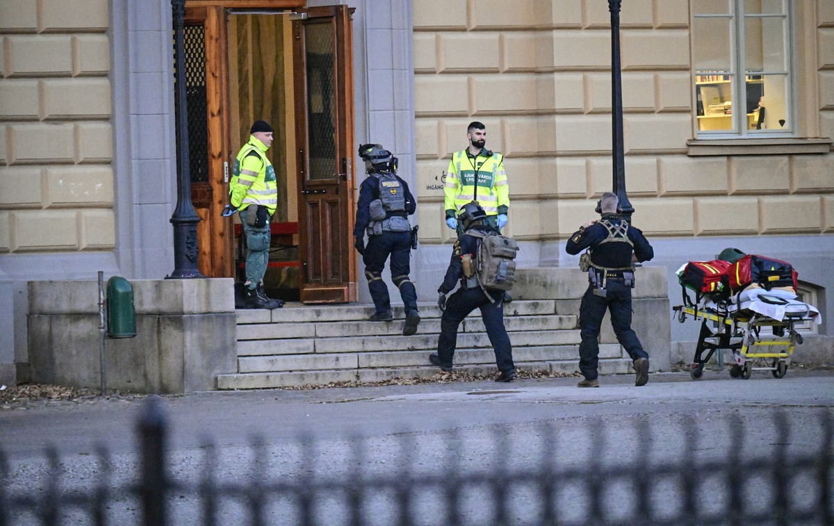 Police officers attend the scene at a school in Malmo, Sweden on Monday, March 21, 2022. Swedish police said Monday at least two people were injured and one person has been arrested in Malmo, after an ...
