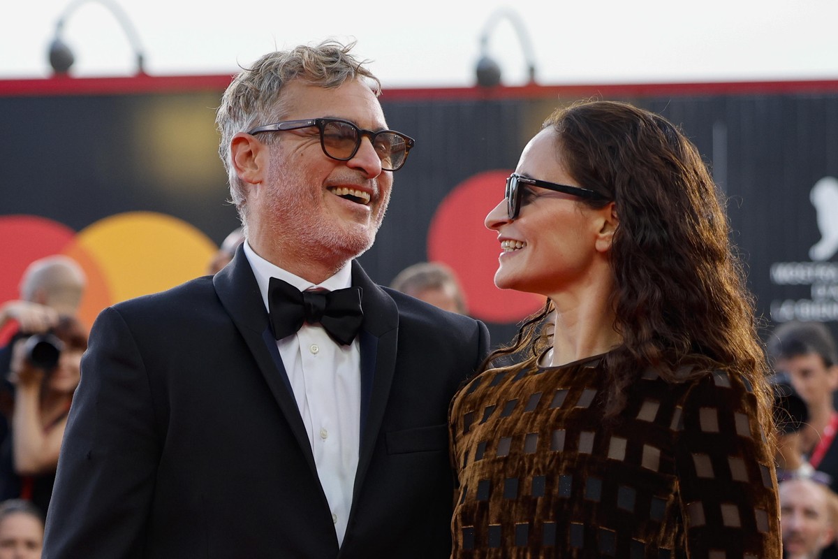 epa11585064 US actor Joaquin Phoenix (L) with his sister Rain Phoenix arrive for the premiere of 'Joker: Folie a Deux' at the 81st annual Venice International Film Festival, in Venice, Italy ...