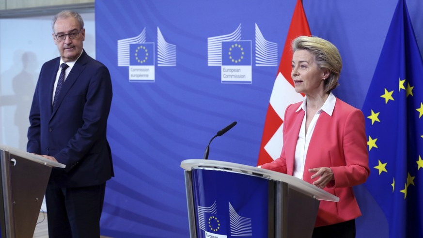 European Commission President Ursula Von der Leyen, right, and Swiss President Guy Parmelin participate in a media conference at EU headquarters in Brussels, Friday, April 23, 2021. (Francois Walschae ...