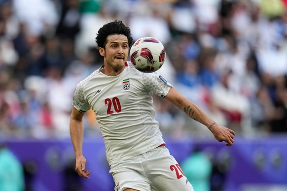 FILE - Iran's Sardar Azmoun controls the ball during the Asian Cup quarterfinal soccer match between Japan and Iran at Education City Stadium in Al Rayyan, Qatar, Saturday, Feb. 3, 2024. (AP Phot ...