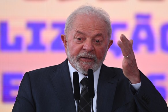 epa10973817 Brazilian President Luiz Inacio Lula da Silva speaks during a ceremony to sanction a new quota law for public universities and federal institutes at the Palacio Planalto in Brasilia, Brazi ...