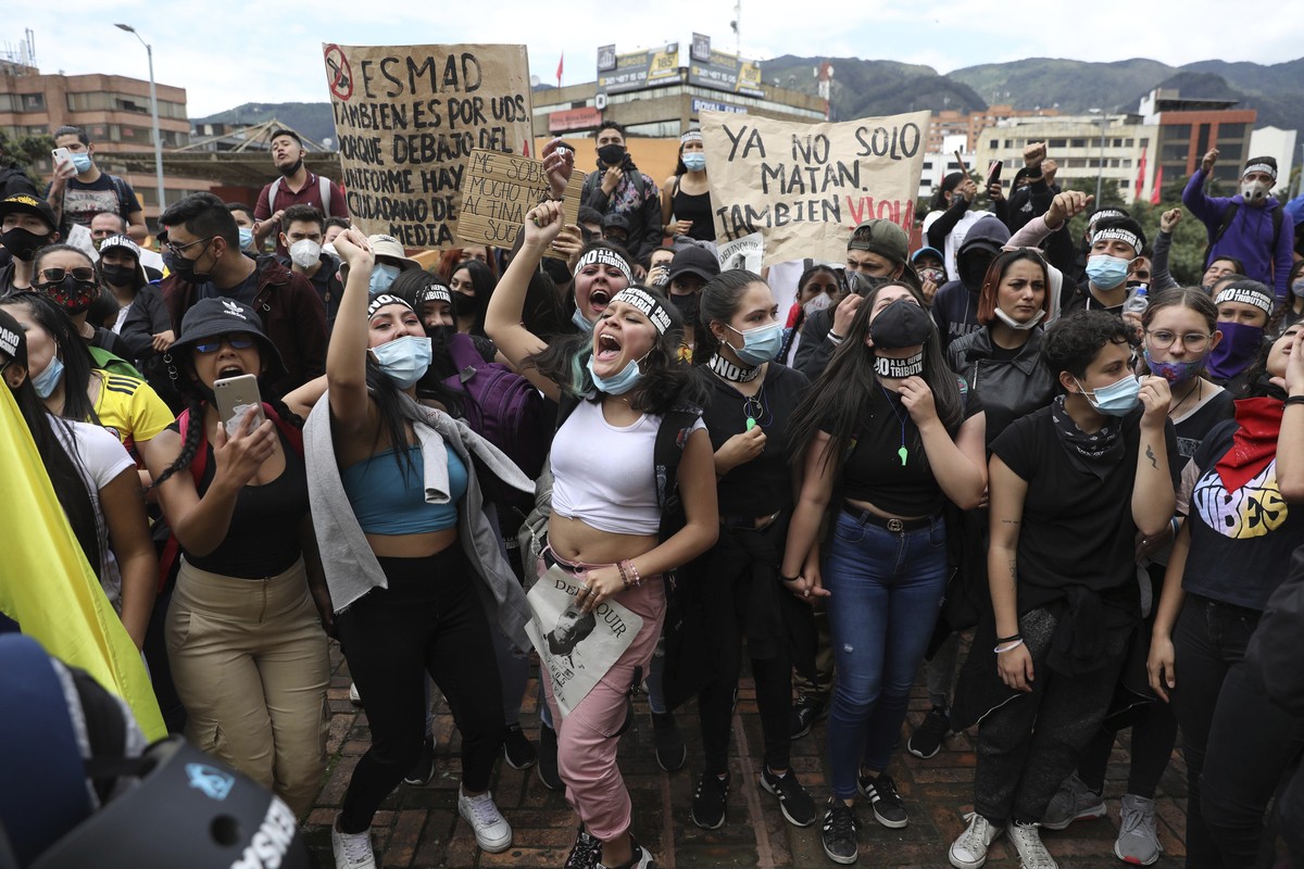 Women shout slogans during a demonstration against government-proposed tax reform, marking May Day, or International Workers' Day, in Bogota, Colombia, Saturday, May 1, 2021, amid the new coronav ...