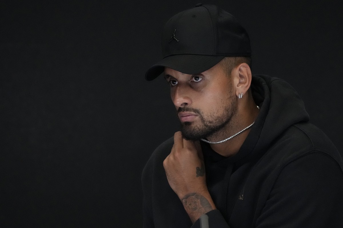 Australia's Nick Kyrgios reacts as he announces his withdrawal from the Australian Open with a knee injury at a press conference in Melbourne, Australia, Monday, Jan. 16, 2023. (AP Photo/Mark Bak ...