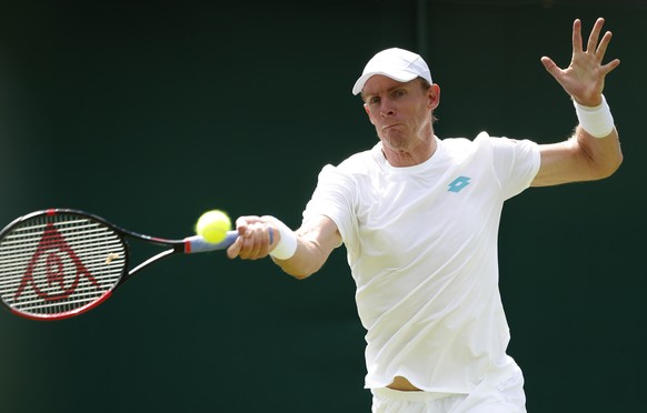 South Africa's Kevin Anderson returns to Pierre-Hugues Herbert of France during their Men's singles matchduring day one of the Wimbledon Tennis Championships in London, Monday, July 1, 2019. ...
