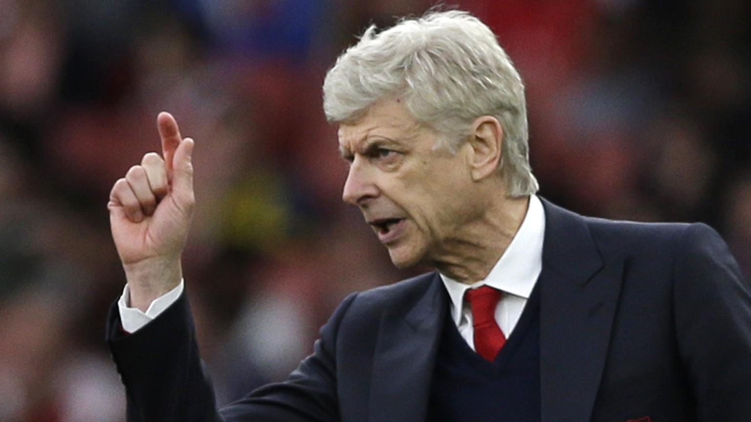 FILE - In this Sunday, April 2, 2017 file photo, Arsenal team manager Arsene Wenger gestures during the English Premier League soccer match between Arsenal and Manchester City at the Emirates stadium  ...