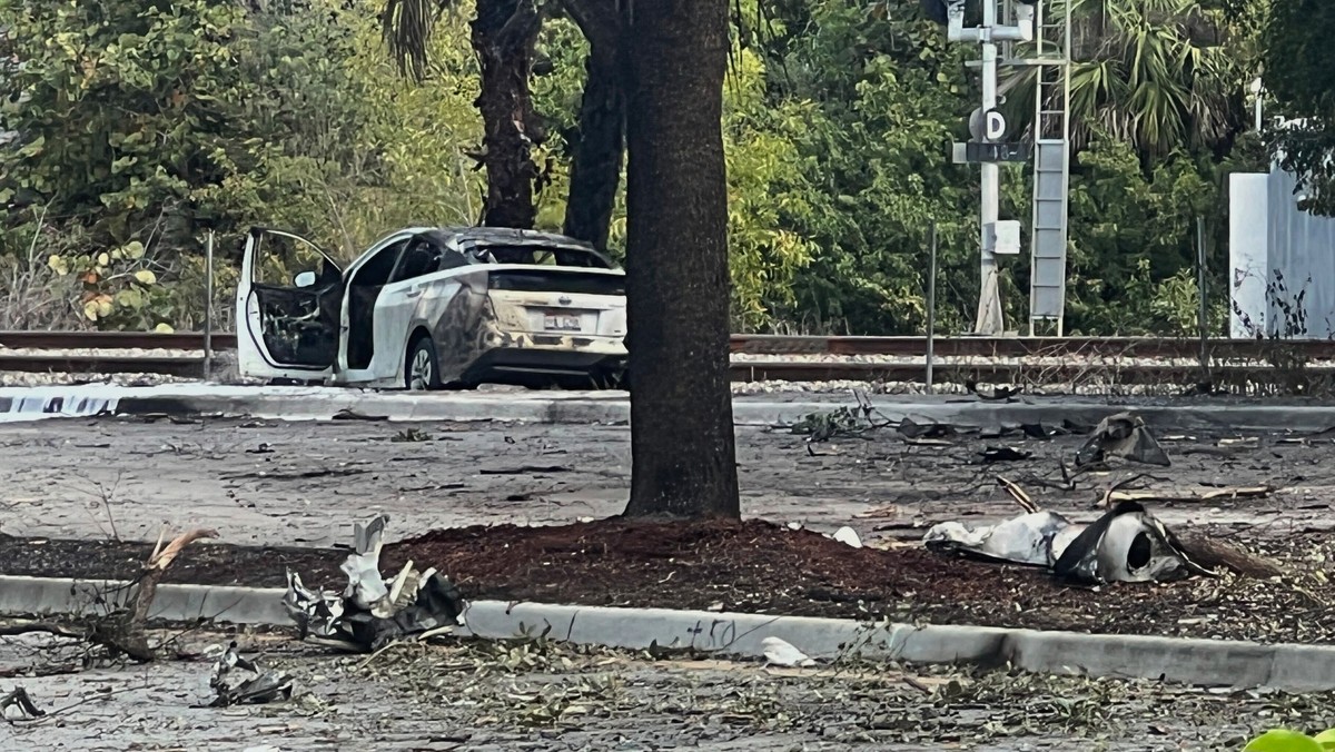 Emergency personnel respond to the area where a small plane crashed on the railroad tracks beneath the overpass near Interstate 95 in Boca Raton, Fla., on Friday, April 11, 2025. (AP Photo/Daniel Kozi ...