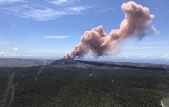 In this photo released by U.S. Geological Survey, ash plume rises above the Puu Oo vent, on Hawaii&#039;s Kilaueaa Volcano Thursday, May 3, 2018 in Hawaii Volcanoes National Park. Nearly 1,500 residen ...