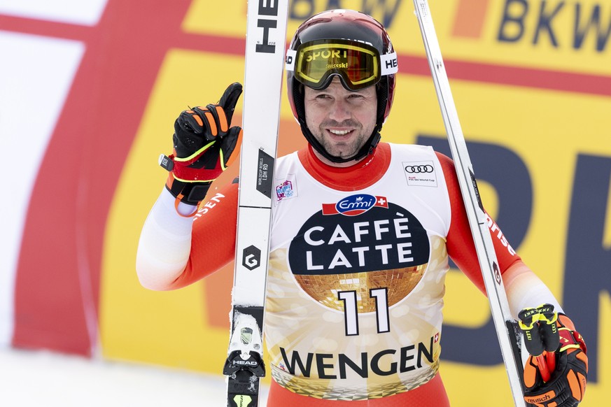 epa10404613 Beat Feuz of Switzerland reacts in the finish area during the men&#039;s downhill race at the FIS Alpine Skiing World Cup in Wengen, Switzerland, 14 January 2023. EPA/PETER KLAUNZER