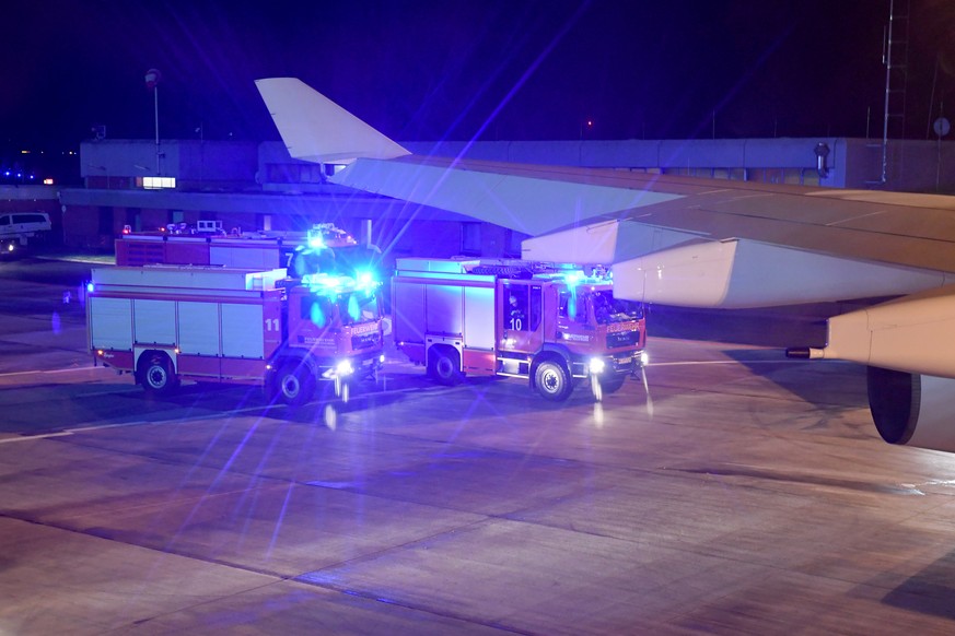 epa07198357 Fire engines are seen from the inside of the Chancellor Airbus &#039;Konrad Adenauer&#039; in Cologne, Germany, 29 November 2018. According to reports, the Chancellor&#039;s Airbus &#039;K ...