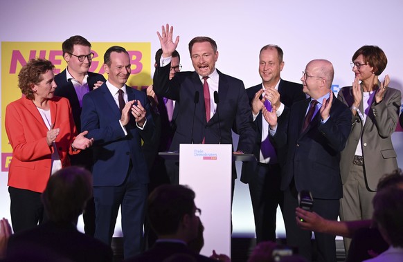Christian Lindner, FDP party leader, and the Liberal party leadership waves at the FDP election party after the first forecasts were announced, in Berlin, Sunday, Sept. 26, 2021. Exit polls show the c ...